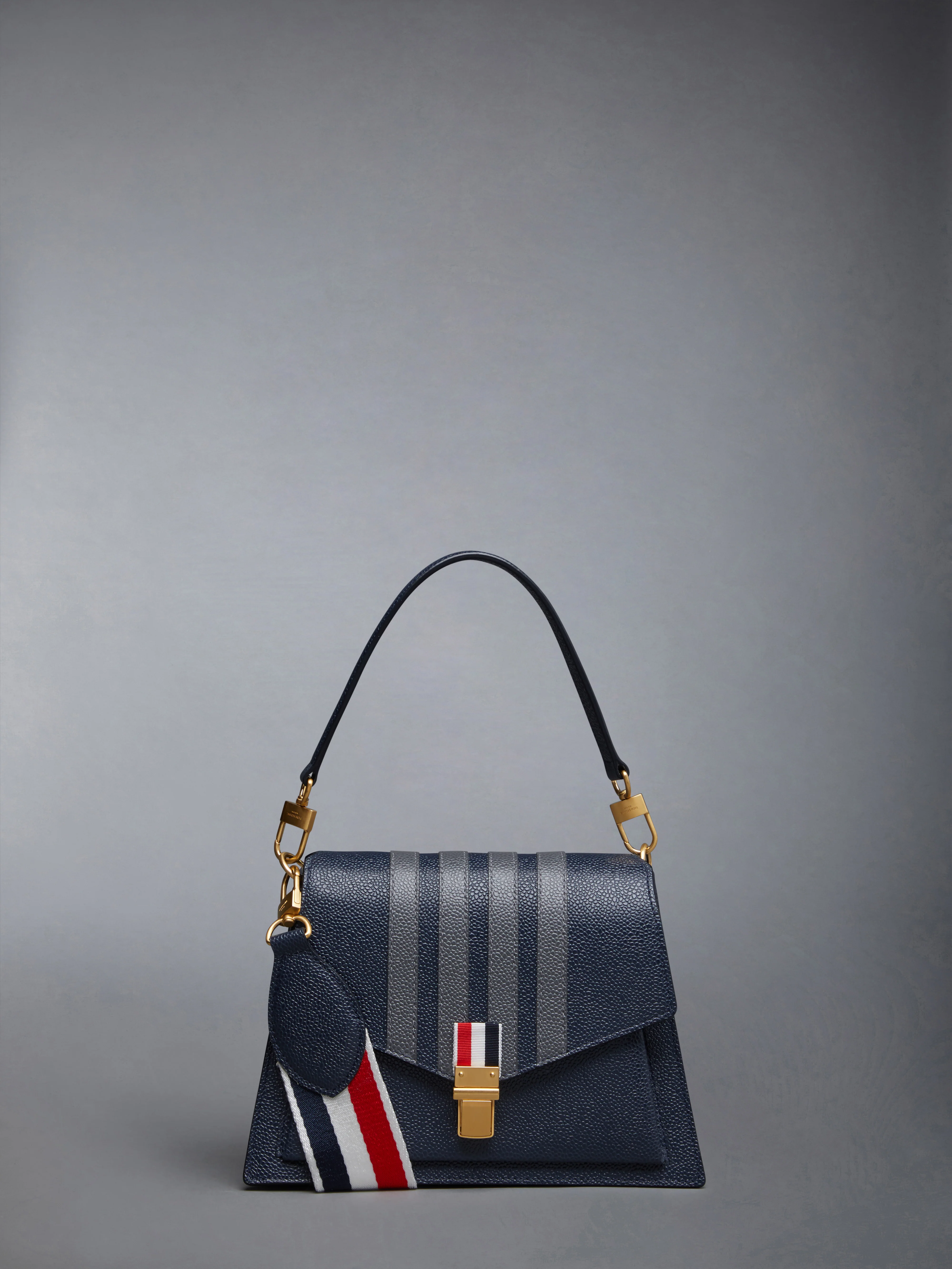 PEBBLE GRAIN LEATHER 4-BAR TRAPEZE BAG