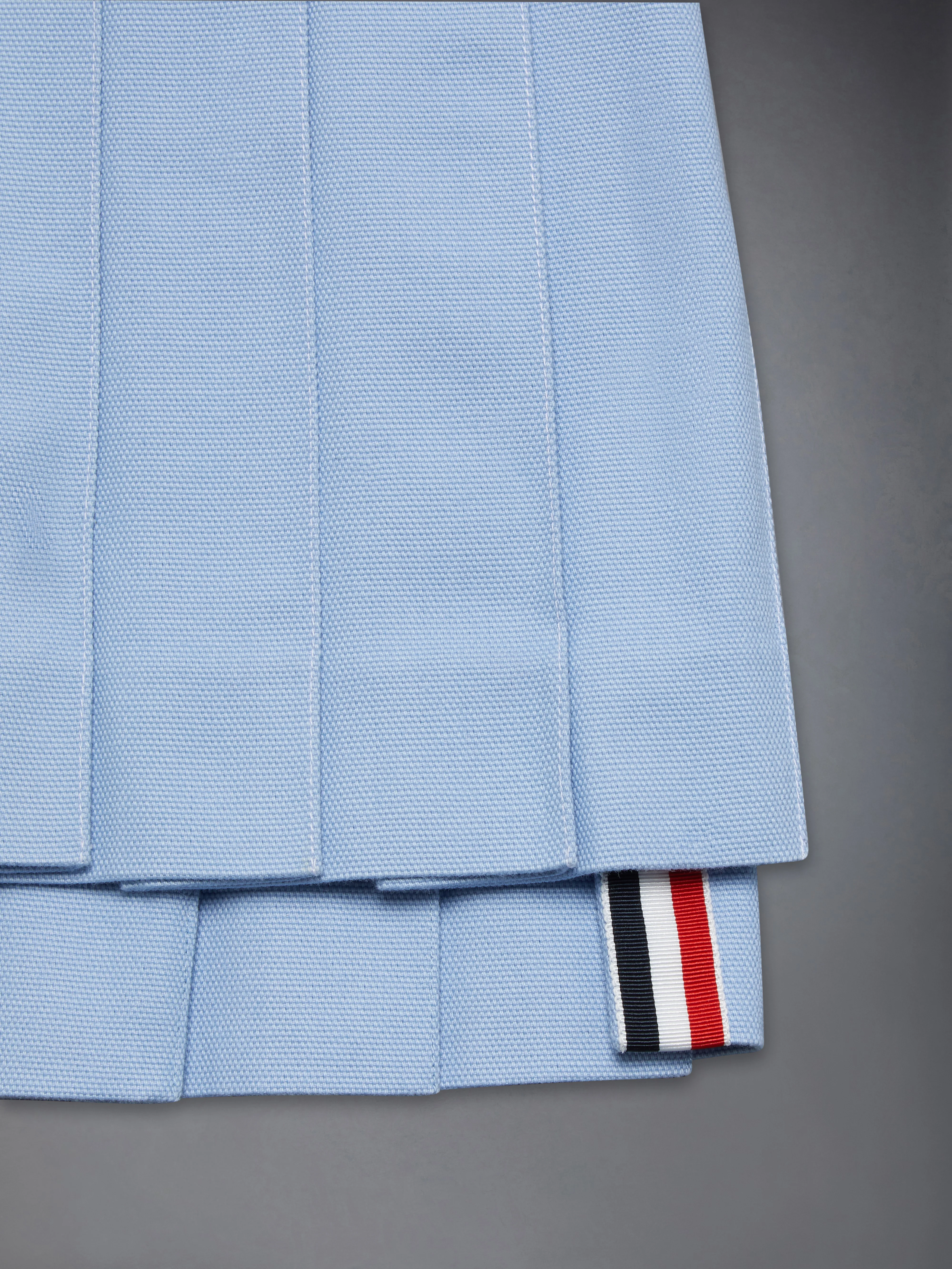 340-children-s-canvas-pleated-mini-skirt-3.webp CHILDREN'S CANVAS PLEATED MINI SKIRT