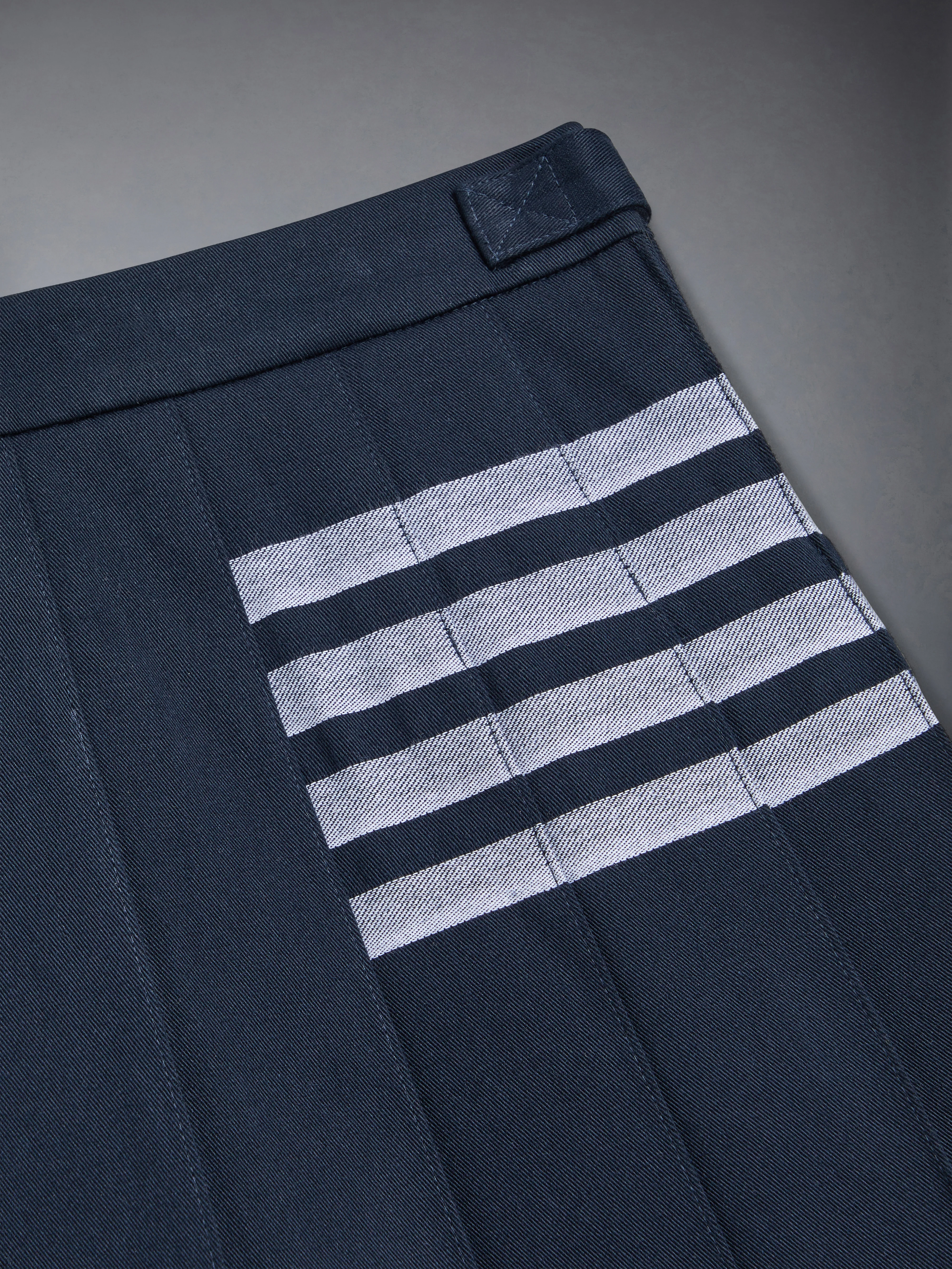 3491-children-s-cotton-4-bar-pleated-mini-skirt-3.webp CHILDREN'S COTTON 4-BAR PLEATED MINI SKIRT