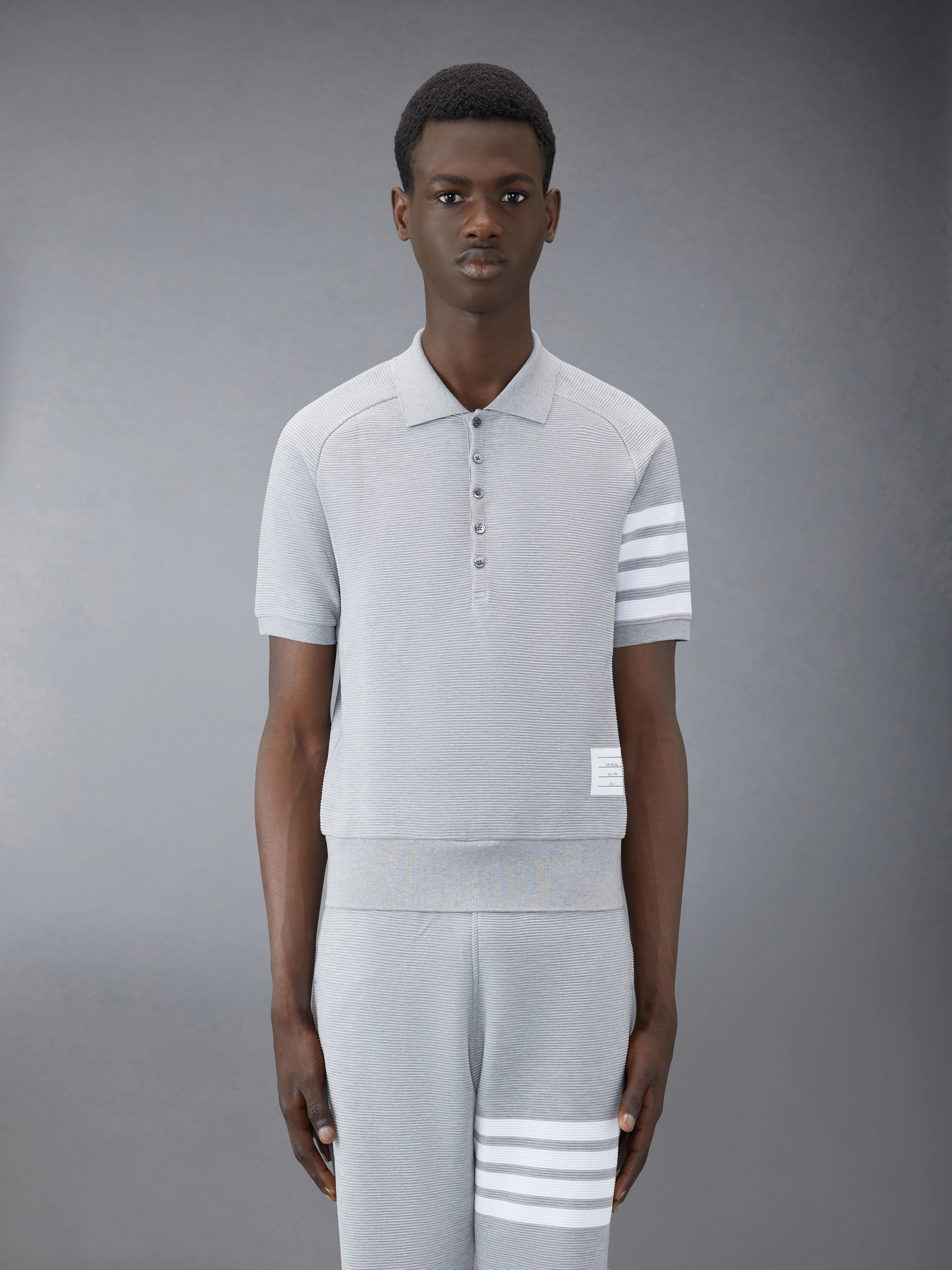 9388-ottoman-4-bar-saddle-sleeve-polo-1.webp OTTOMAN 4-BAR SADDLE SLEEVE POLO