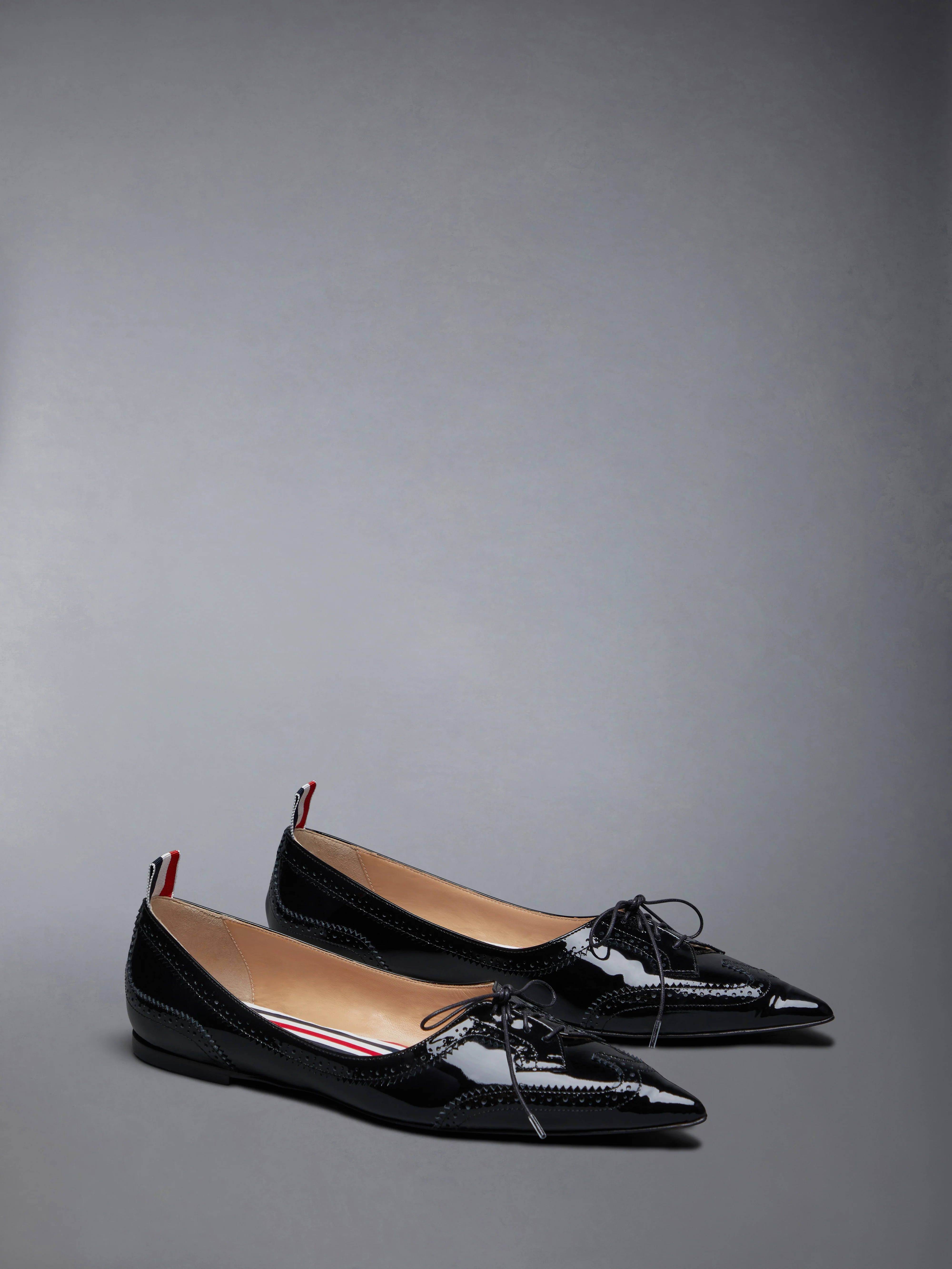 PATENT POINTED WINGTIP BALLERINA